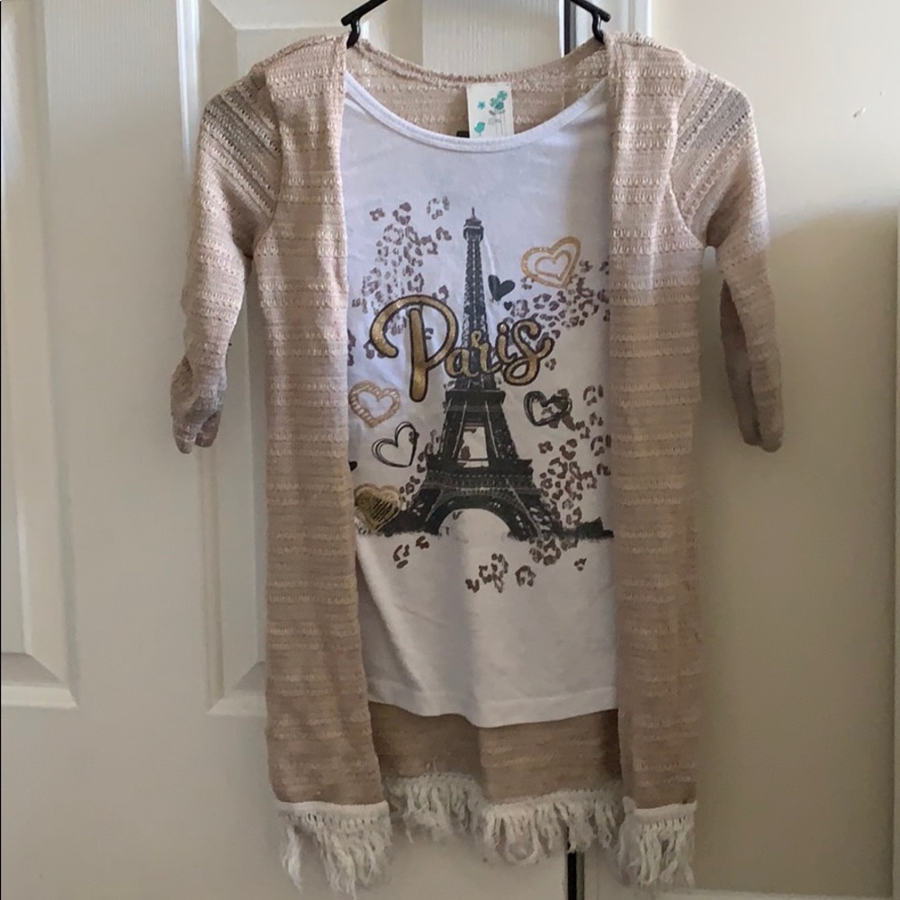 A blouse with a shirt connected to it